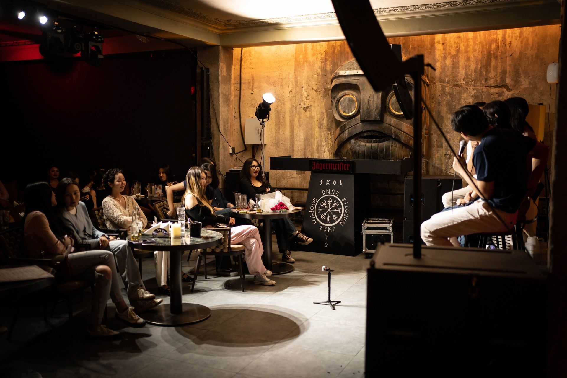 Clap Comedy Club stage with microphone and spotlight